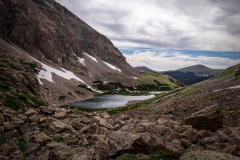 View of upper Hutcheson Lake as seen from above tree line in Rocky Mountain National Park, summer time.