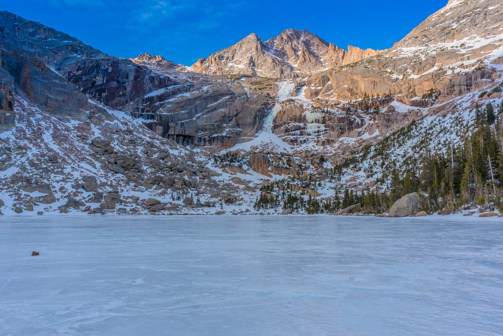 Black Lake, frozen alpine lake in Rocky Mountain National Park, November 2019