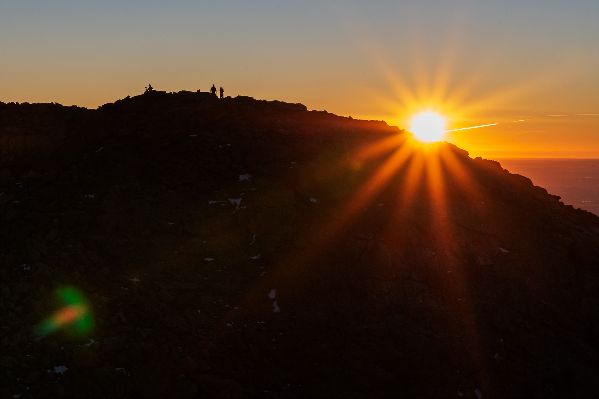 Hikers, photographers on Twin Sisters East Peak at sunrise
