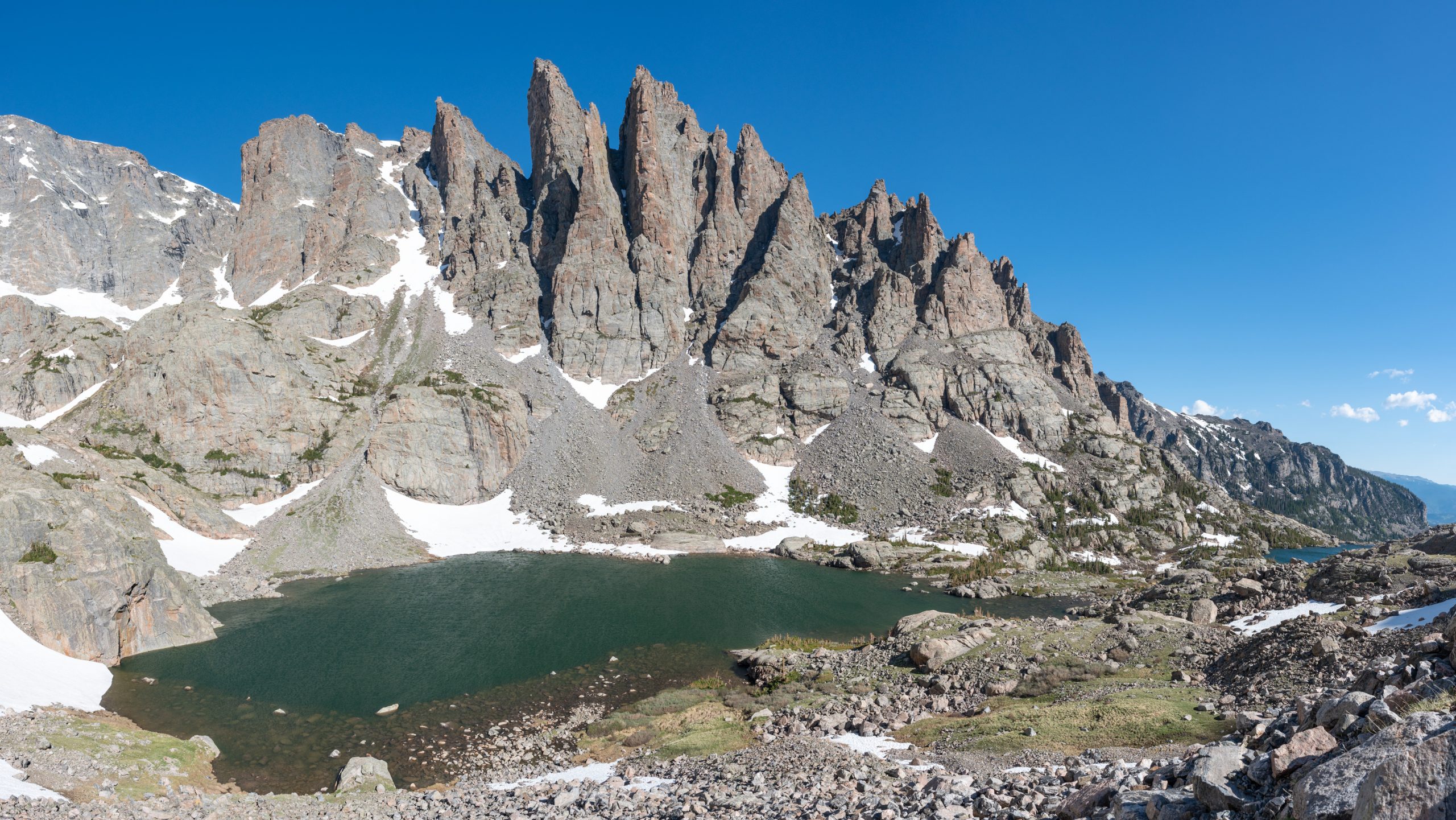 Panorama of Sky Pond, Lake of Glass and the Sharktooth, mountains and alpine lakes