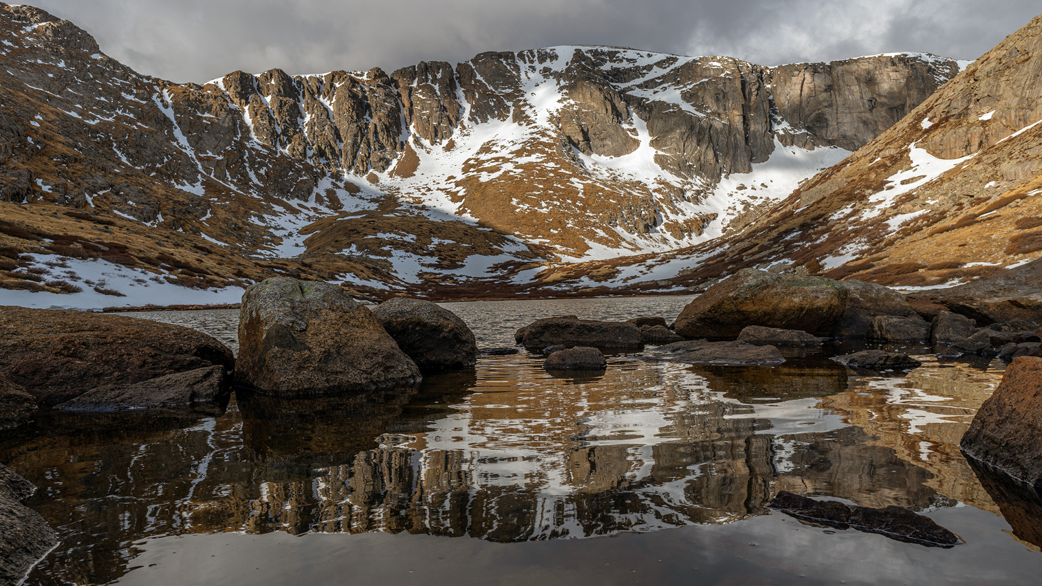 Low angle reflections on Upper Chicago Lake taken during the spring in Mt evans wilderness