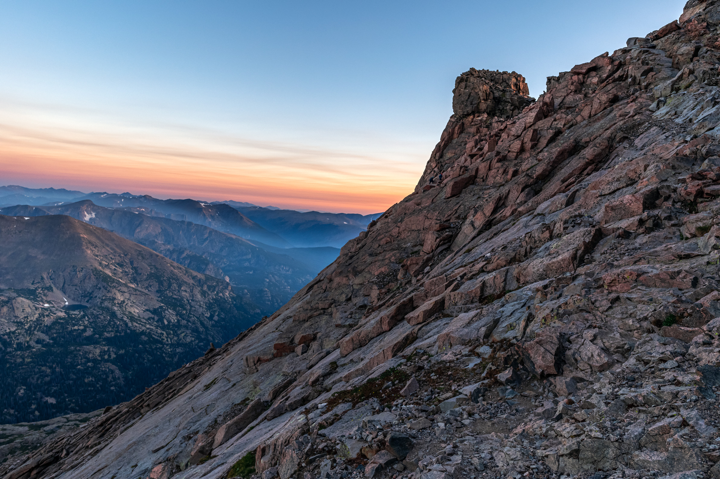 ledges of longs peak looking at the keyhole during sunrise in the summer