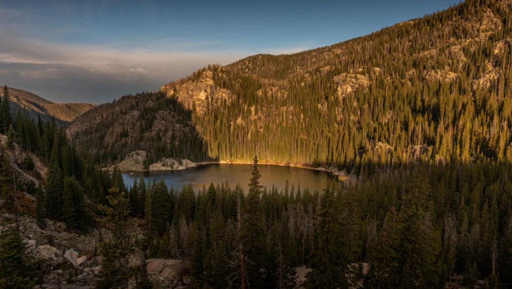Early Morning sunlight illuminates Lone Pine Lake and the surrounding forest