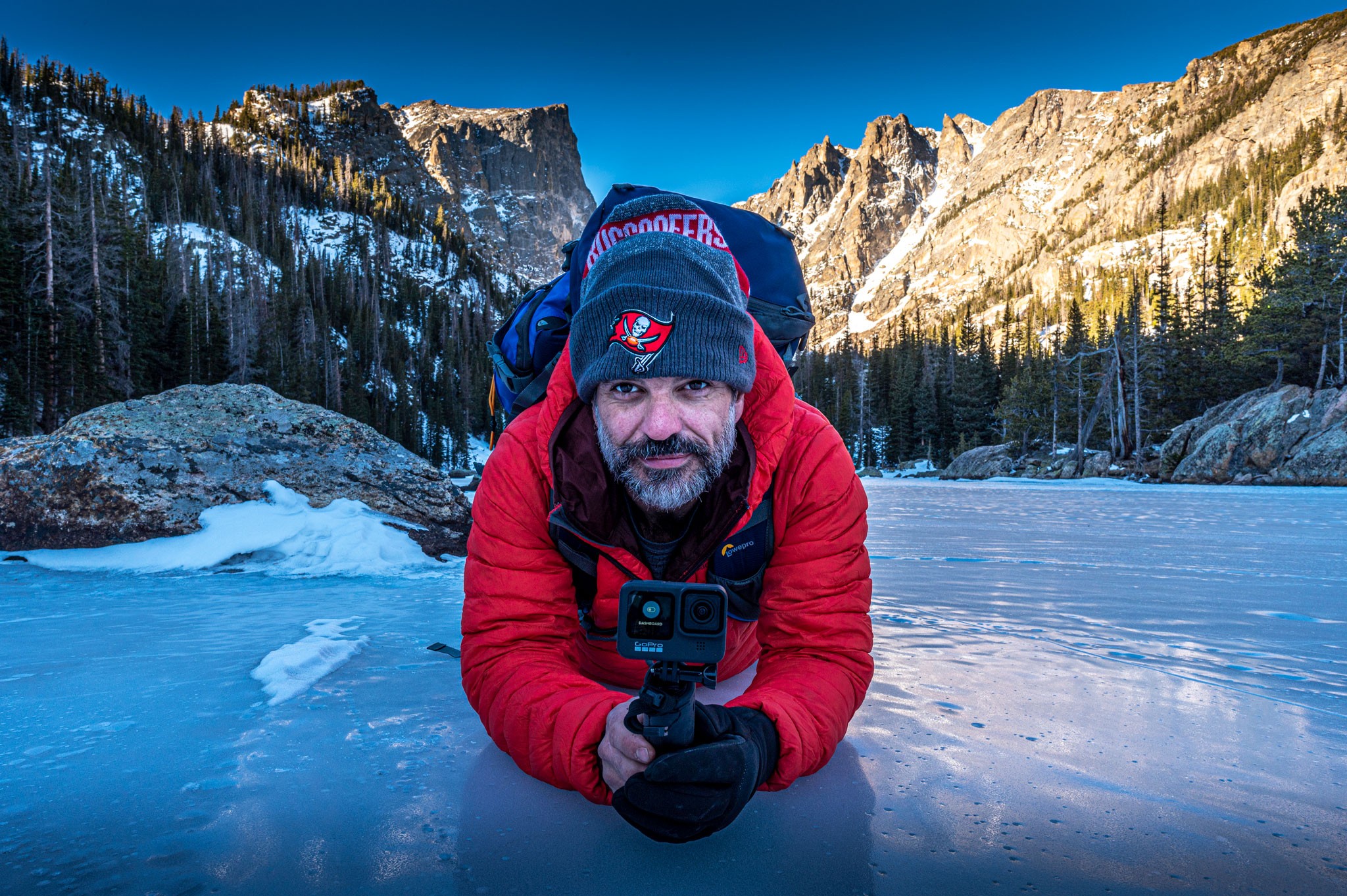 Dave Spates laying on ice at dream lake