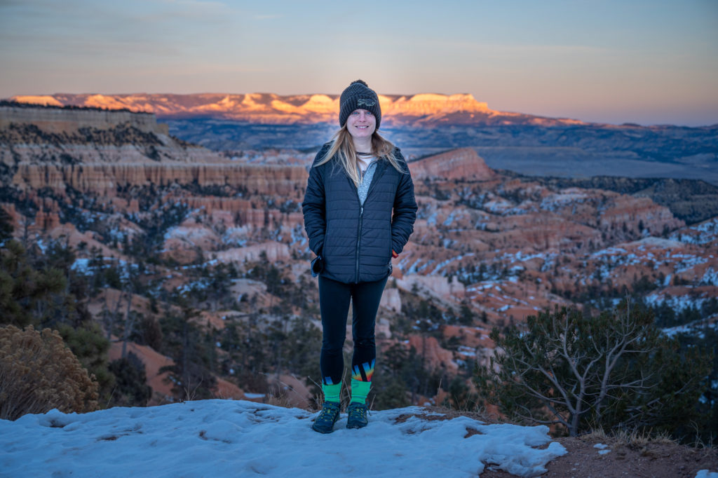 hiker at sunset point in bryce canyon national park