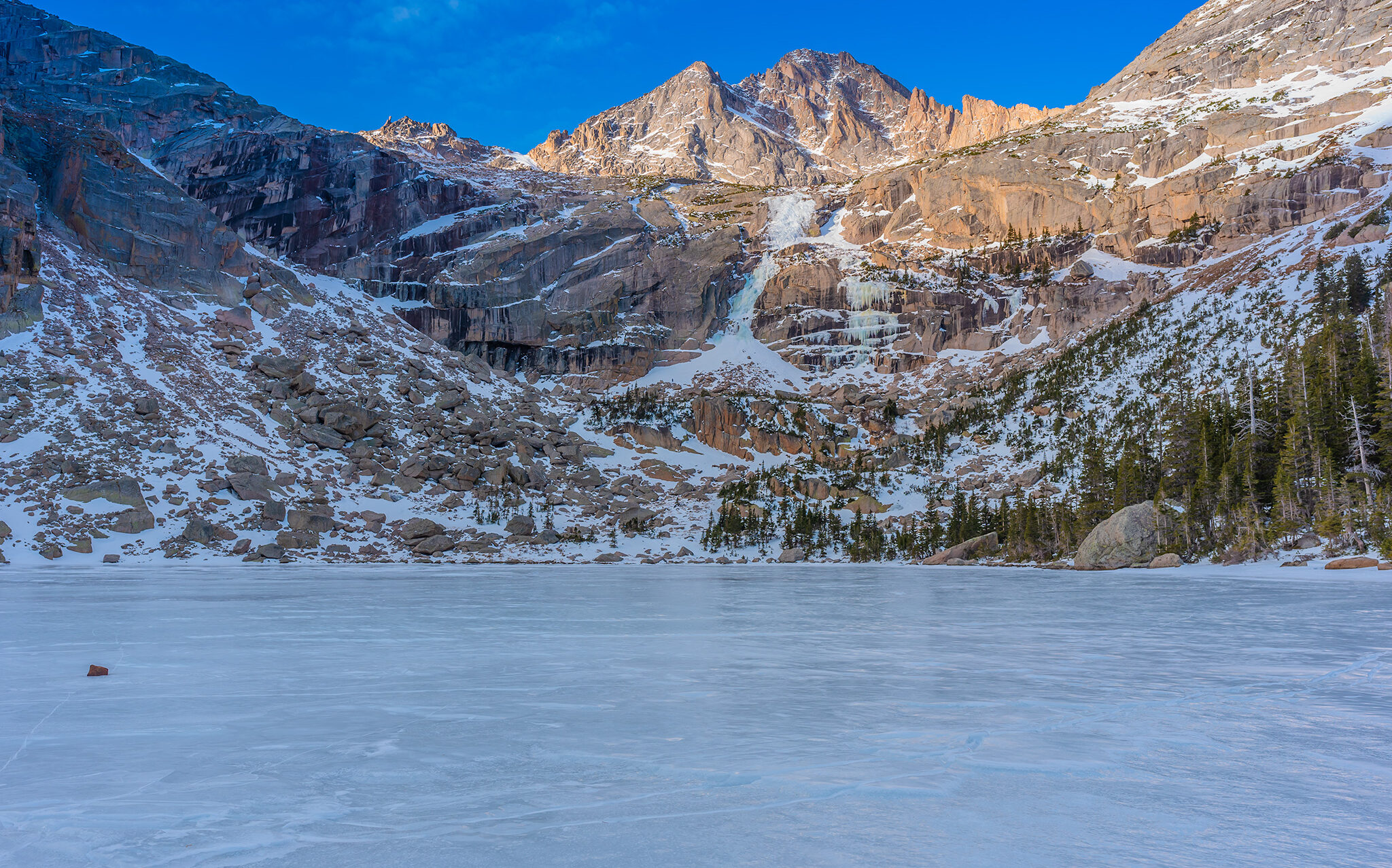 Black Lake, frozen alpine lake in Rocky Mountain National Park, November 2019