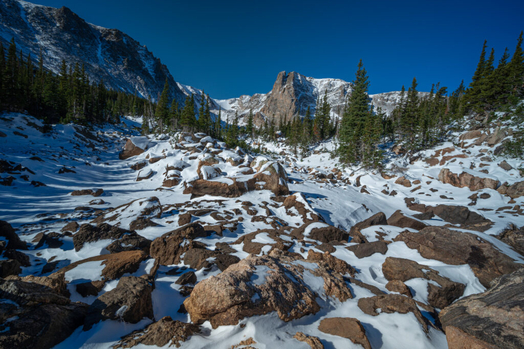marigold pond covered in snow with Notchtop Mountain in the background