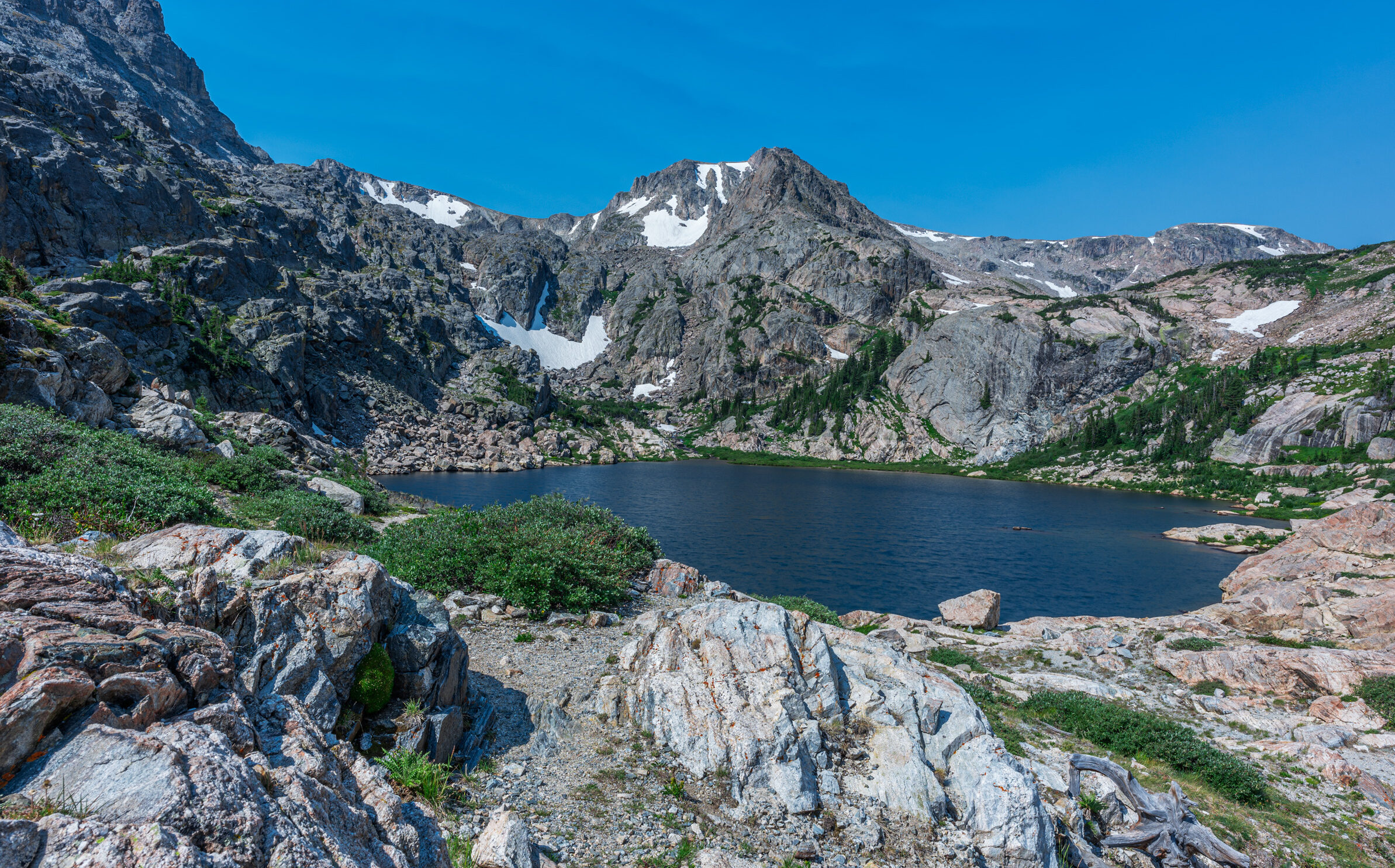 Bluebird Lake with Ouzel Peak in the background, clear skies, summer time