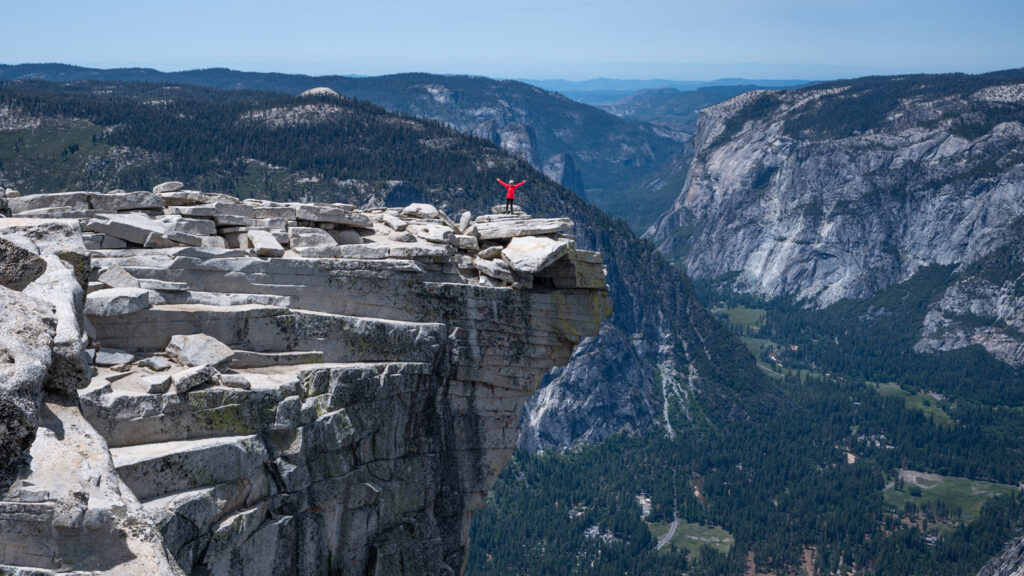 Emily out of the ledge on the summit of Half-dome