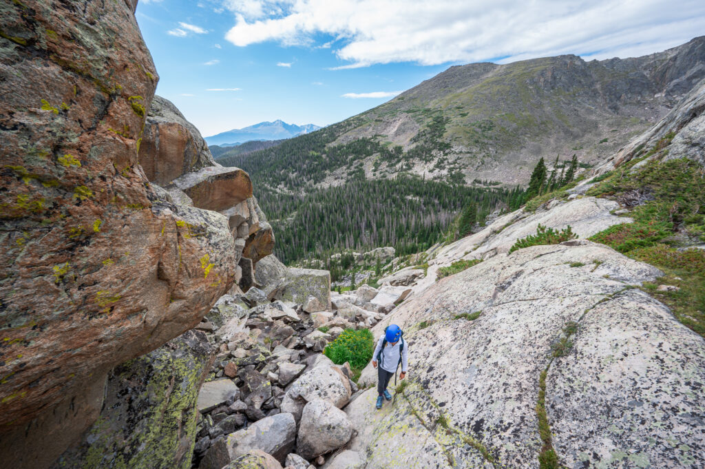 Emily navigating through the rocky terrain up to Spectacle Lakes
